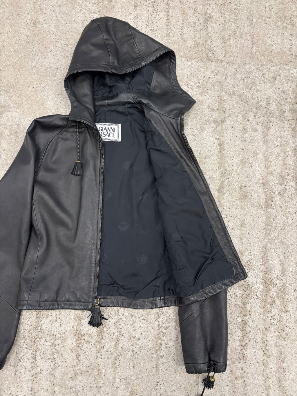 1990's Gianni Versace Cropped High-Neck Hooded Leather Jacket With Tassels Decoration