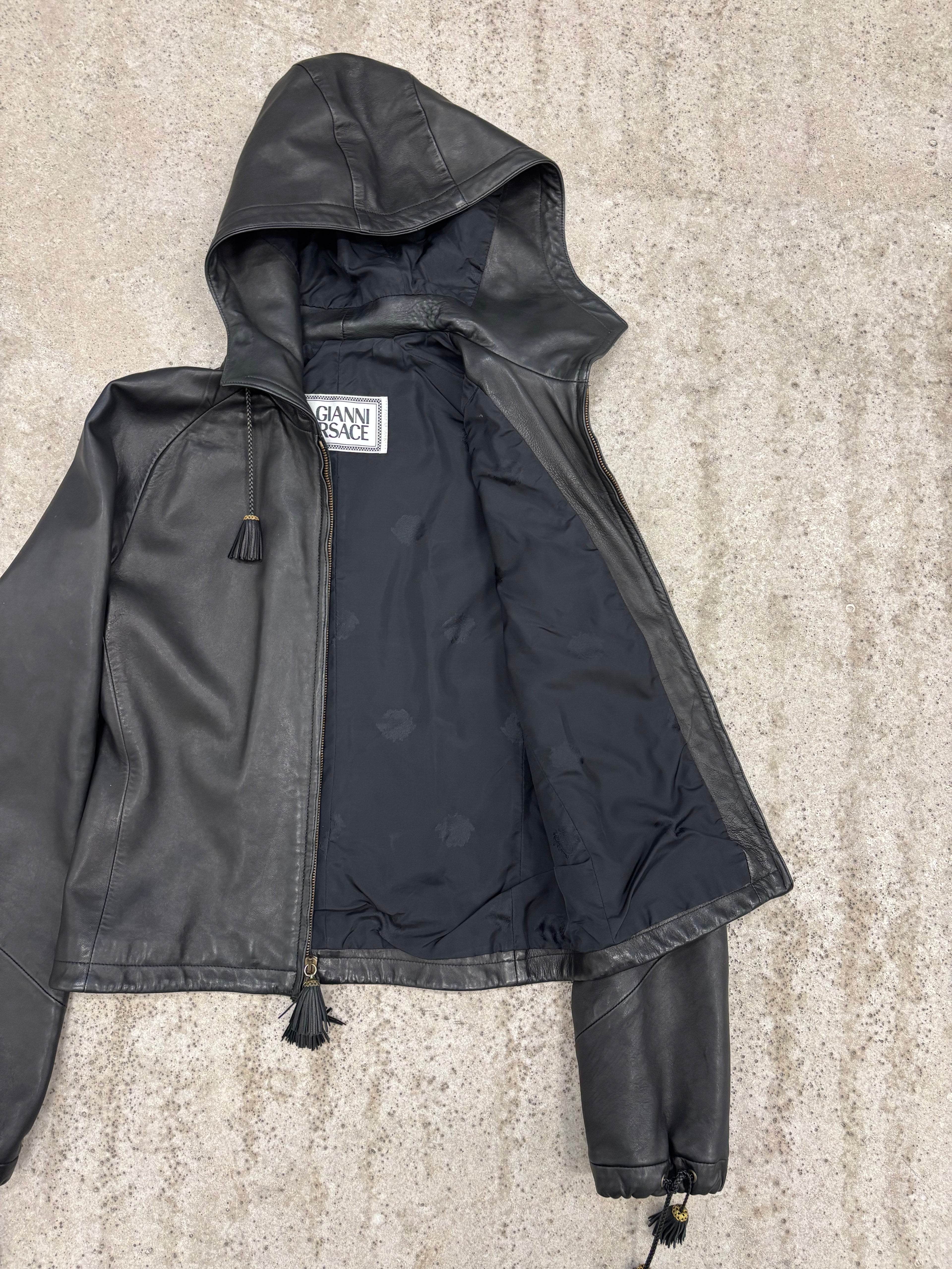 1990's Gianni Versace Cropped High-Neck Hooded Leather Jacket With Tassels Decoration